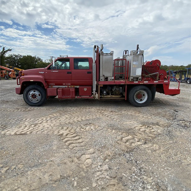 Fuel truck parked at a construction site, ready to refuel heavy machinery and equipment.